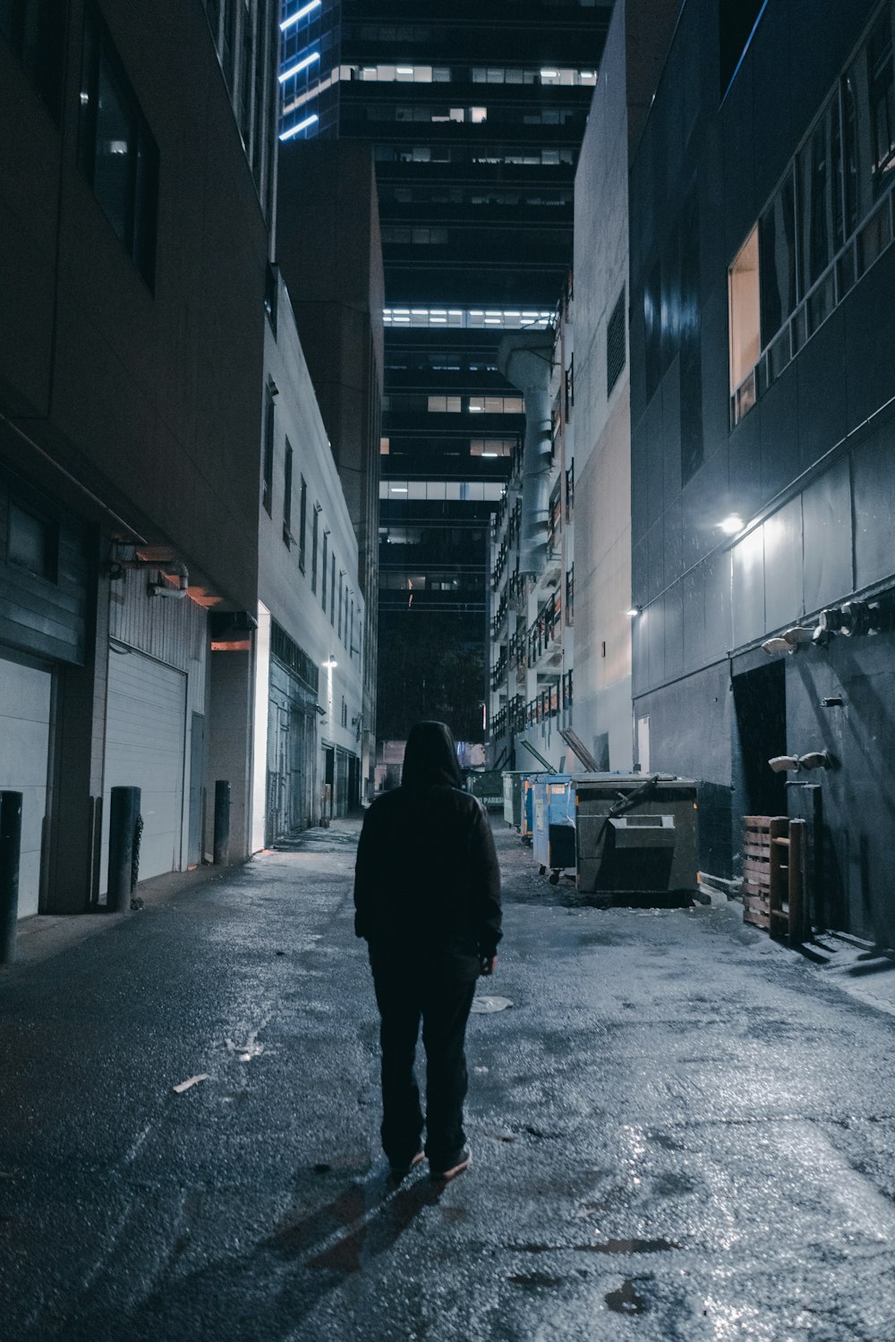 person in a alley during nighttime with lights