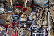 assorted-color metal vase and containers