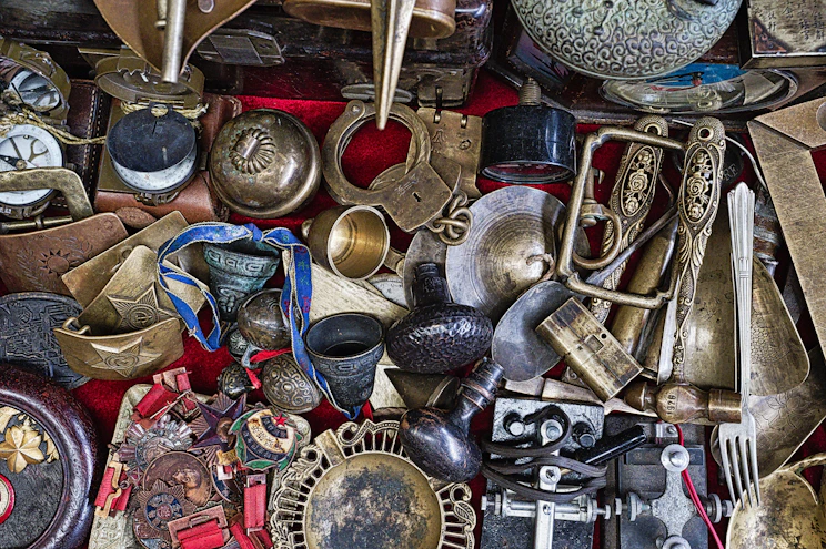 assorted-color metal vase and containers