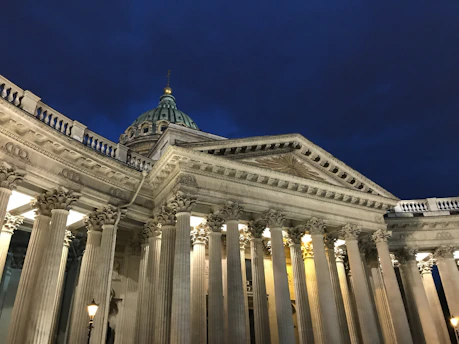 Abstract dark architectural details of a modern parliament building at dusk.