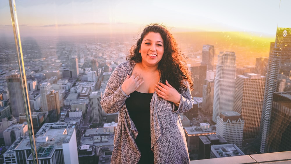 woman standing on building rooftop