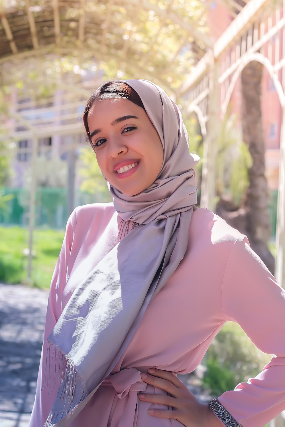 women's purple hijab under gray building