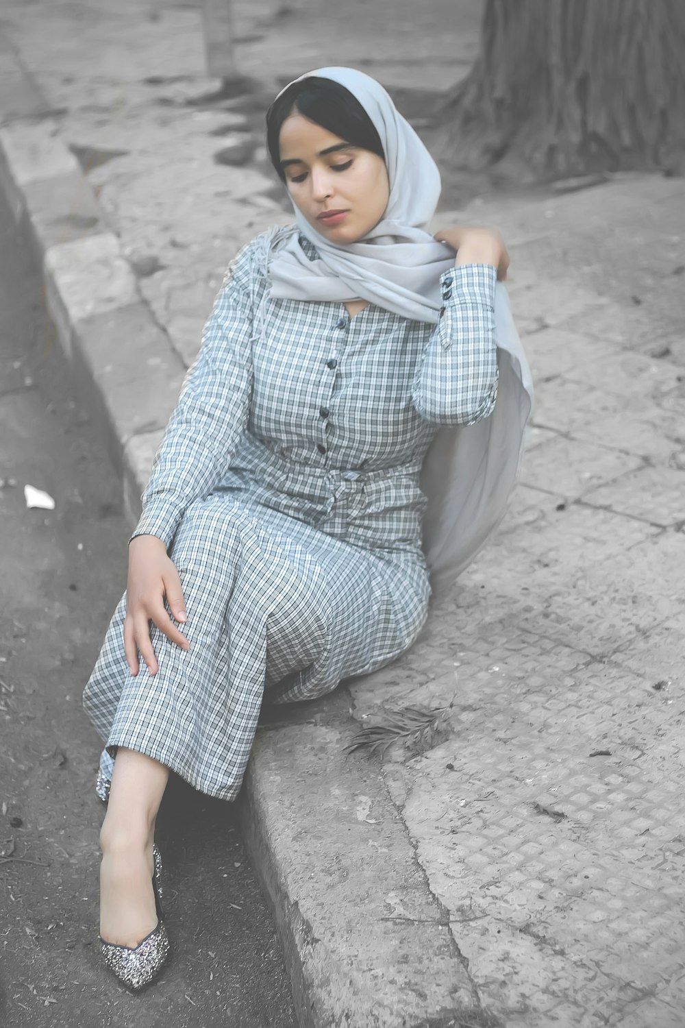 woman sitting on ground