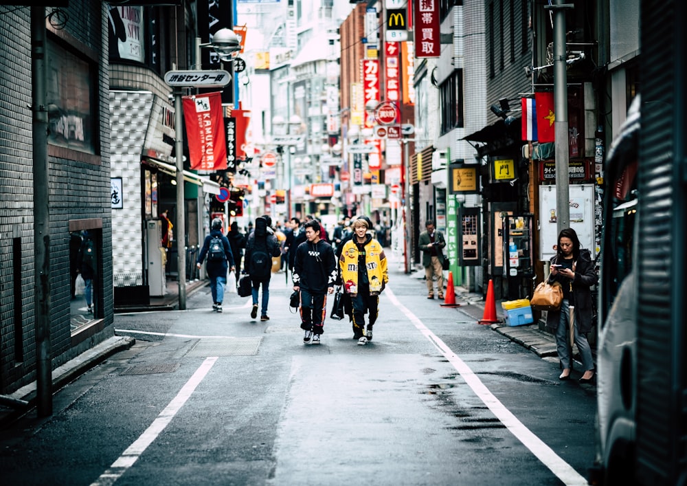 people in city alley