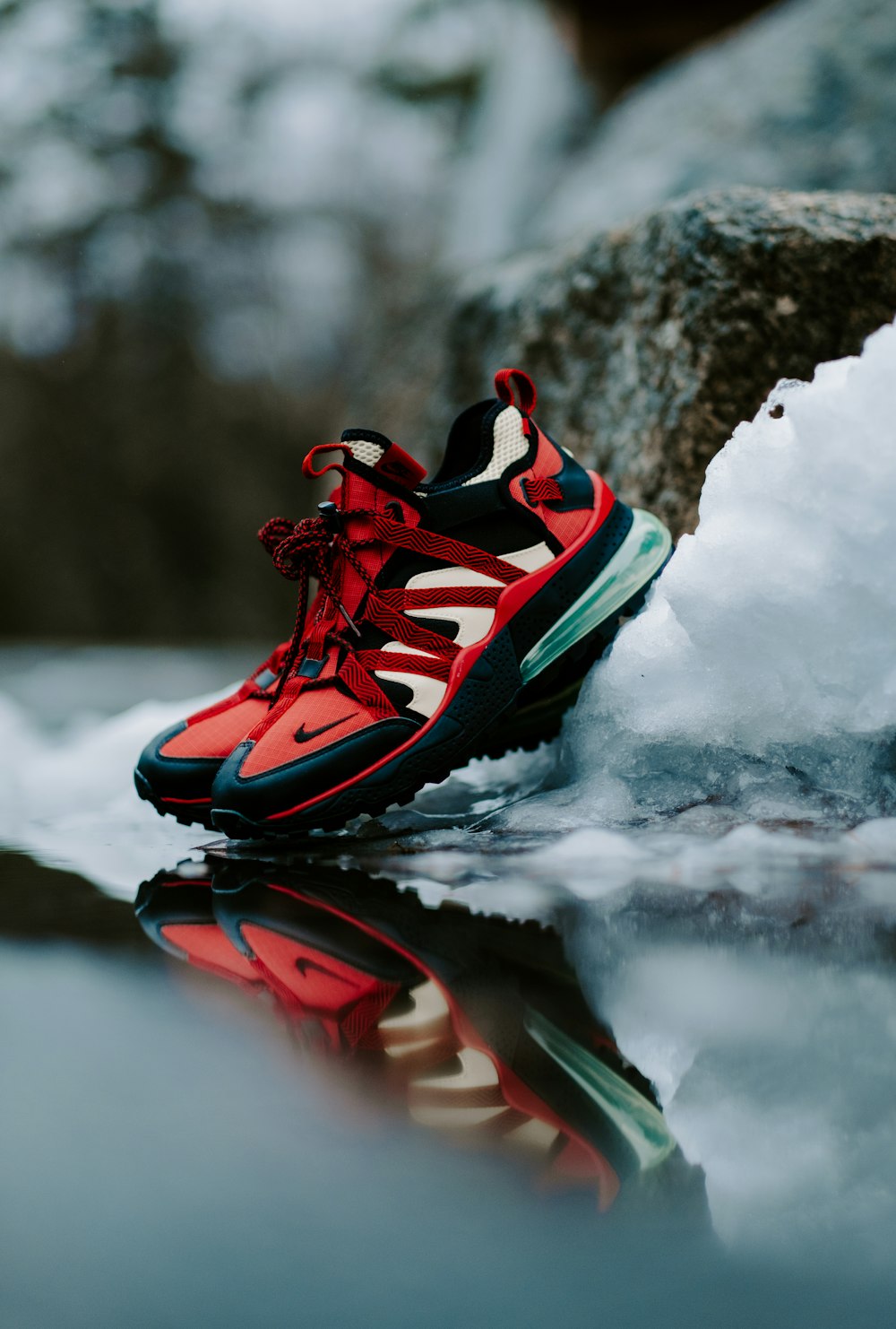 pair of red-and-black Nike running shoes