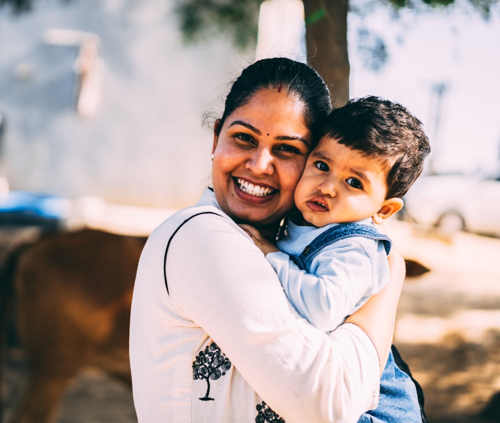 woman hugging boy