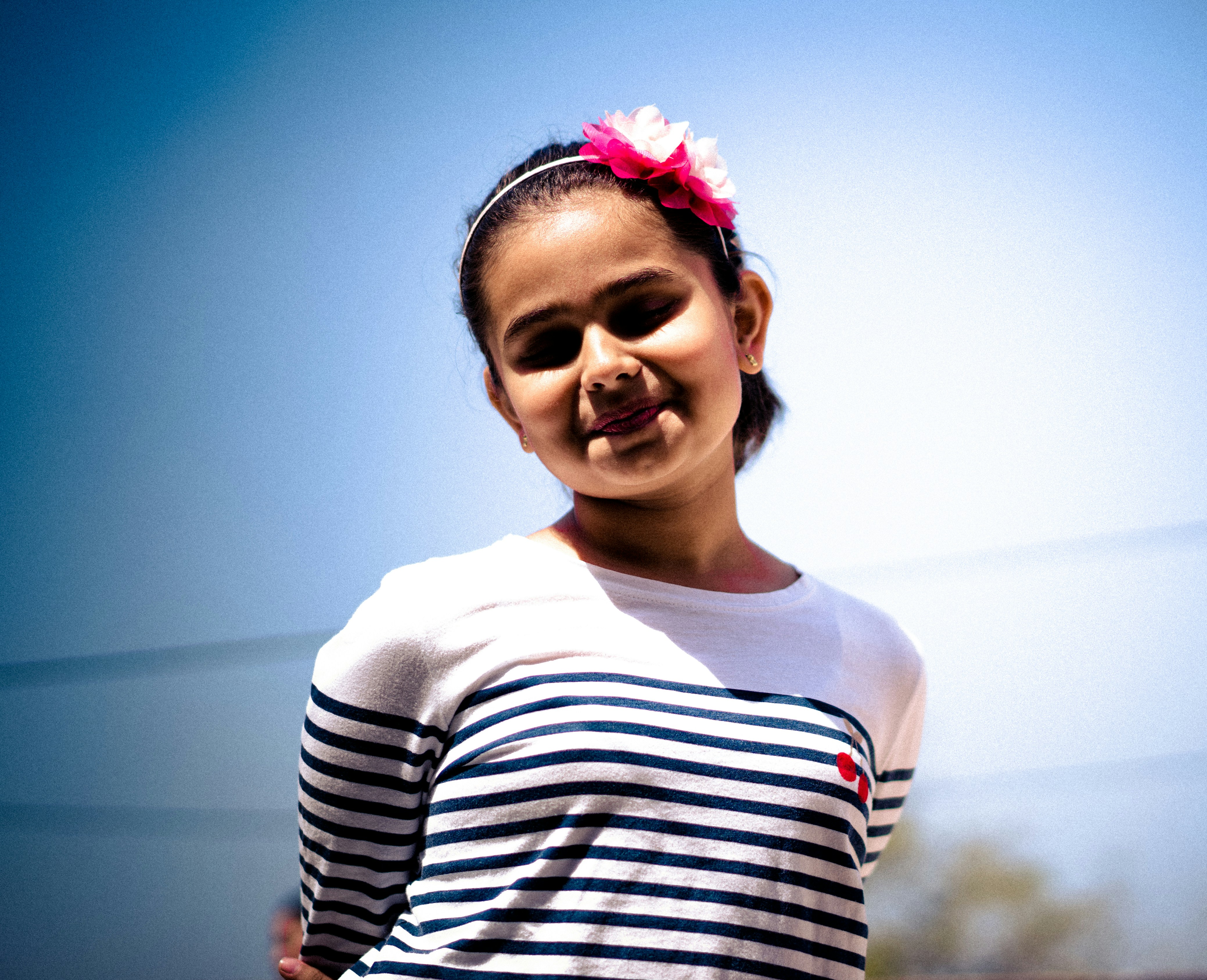 girl wearing white and black striped sweater