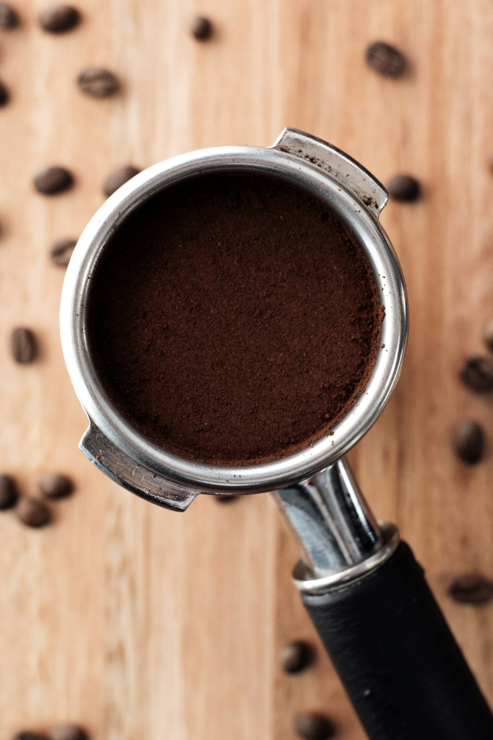 ground coffee on stainless steel cup