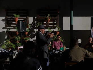 A lively workshop scene with trumpet players of various ages practicing together in a sunlit room.
