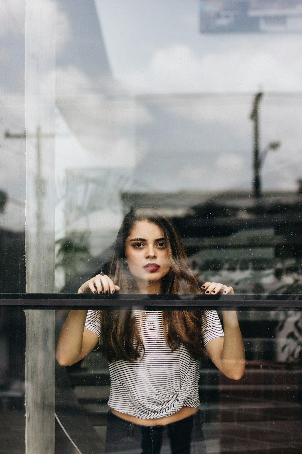 woman wearing black and white striped shirt