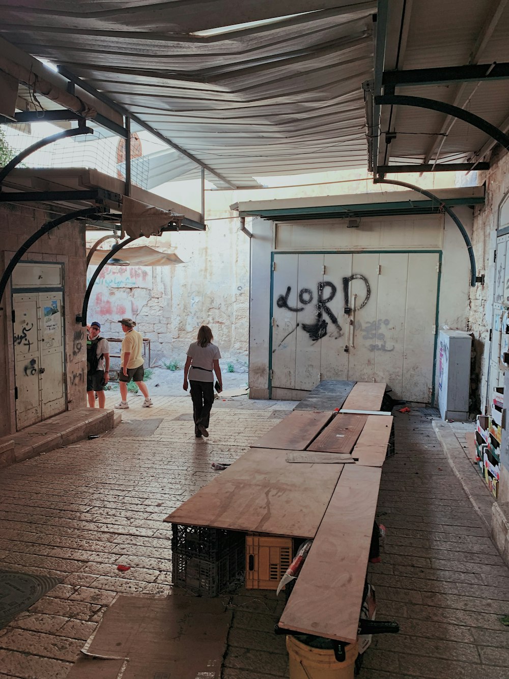 man walking through table inside building during daytime