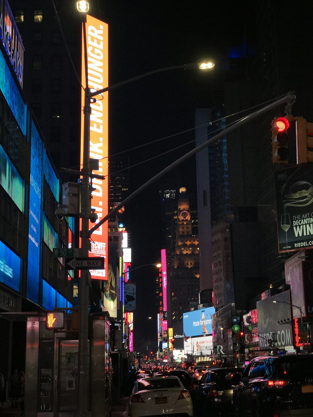 vehicles passing between lighted buildings