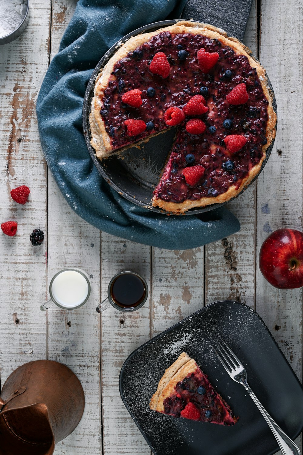 cooked pie with blueberries and strawberries