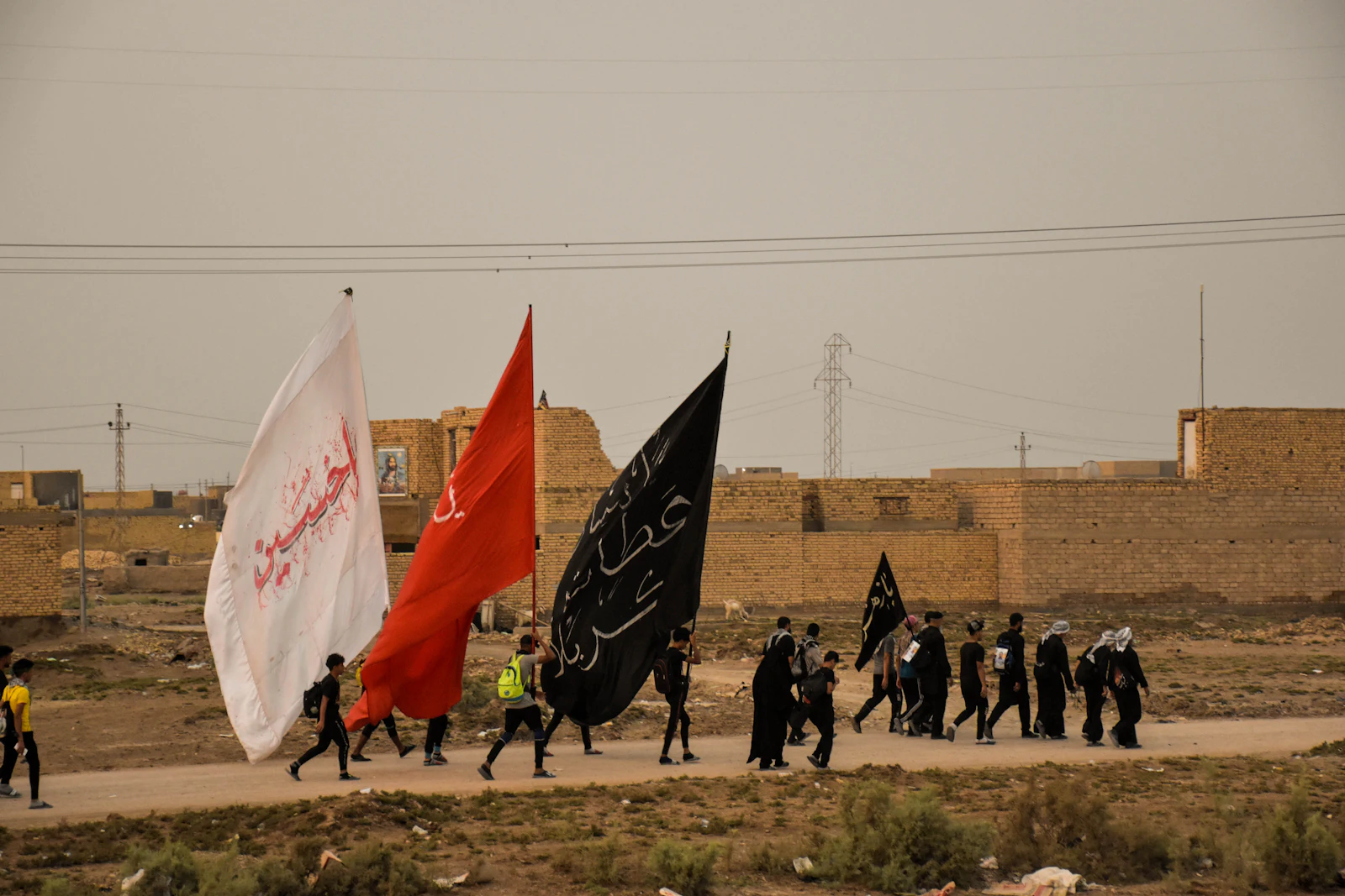 Marchers with red, white and black flags filling the street