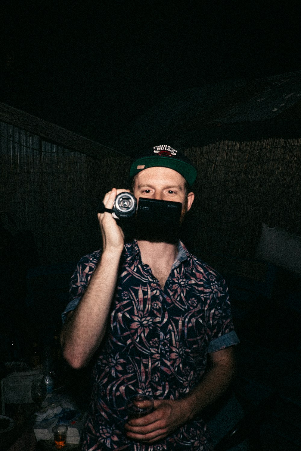 man holding black DSLR camera