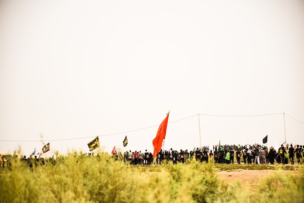 people gathered in empty field