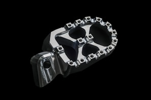 Close-up of a freshly manufactured steel flange with smooth edges and precise bolt holes