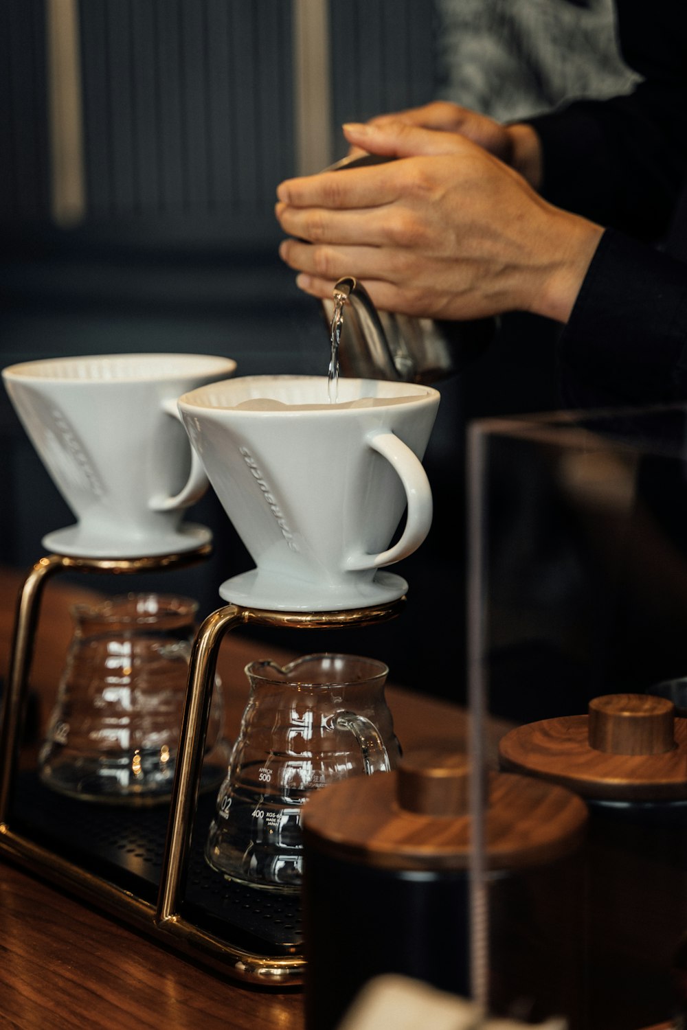 two ceramic cups on rack