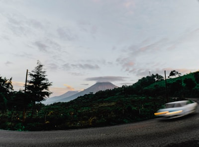 A scenic view of Lombok with a rental car.