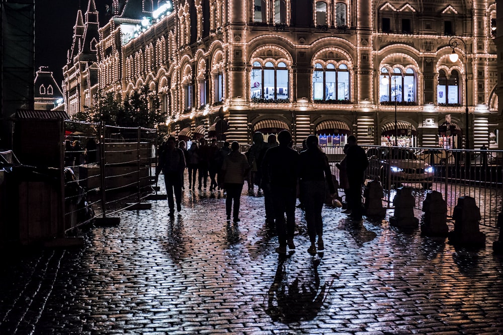 people walking near outdoor during nighttime