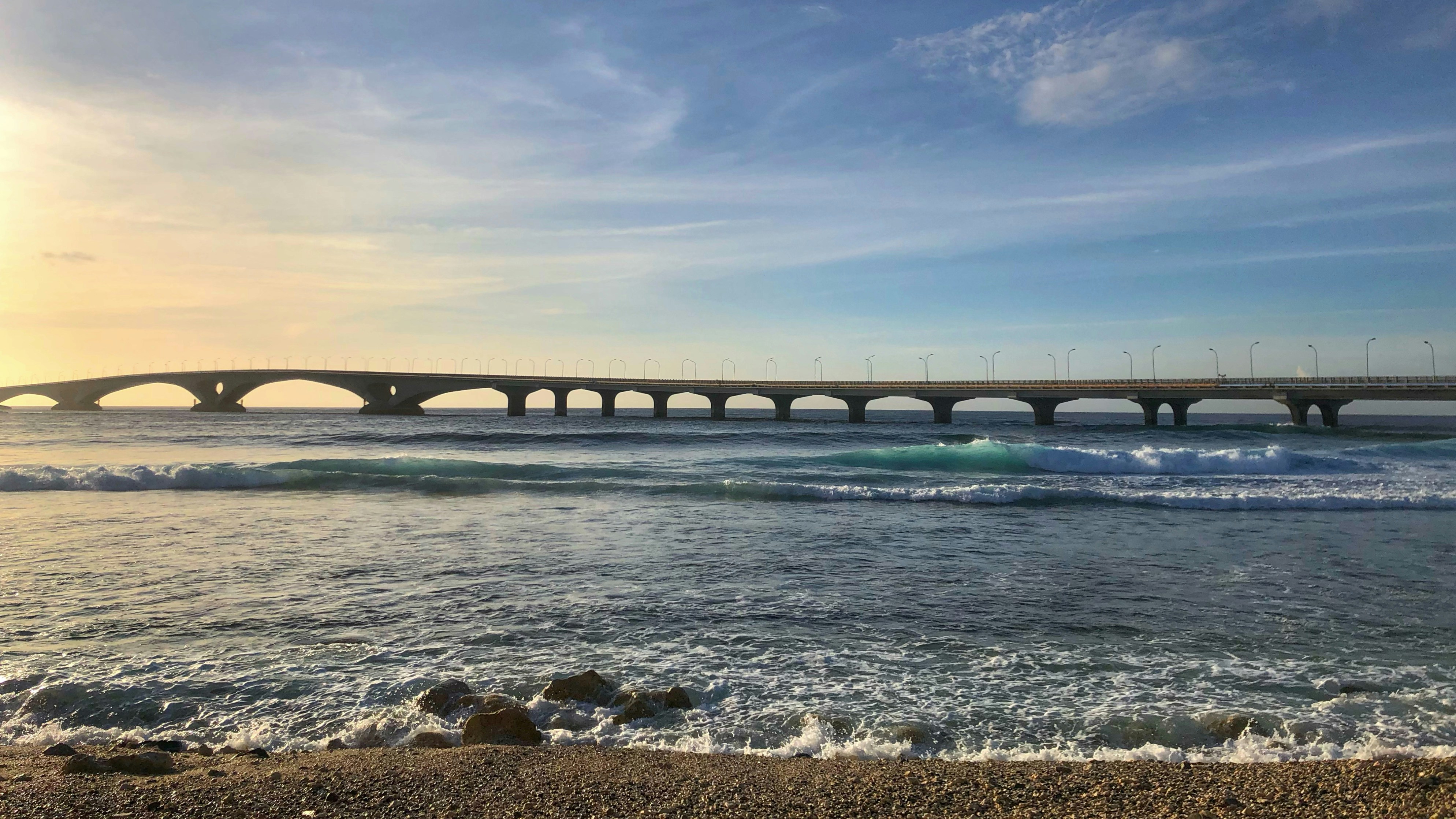 gray bridge on body of water