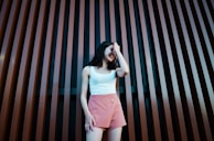 women holding her head close-up photography