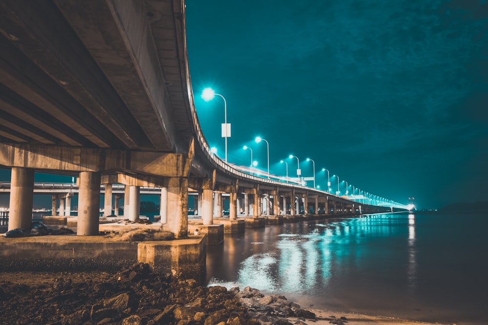 concrete bridge with lights at night