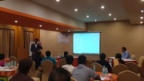 A professional workshop setting with engaged participants.