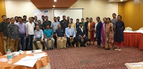 A diverse group of professionals collaborating during an online training session.