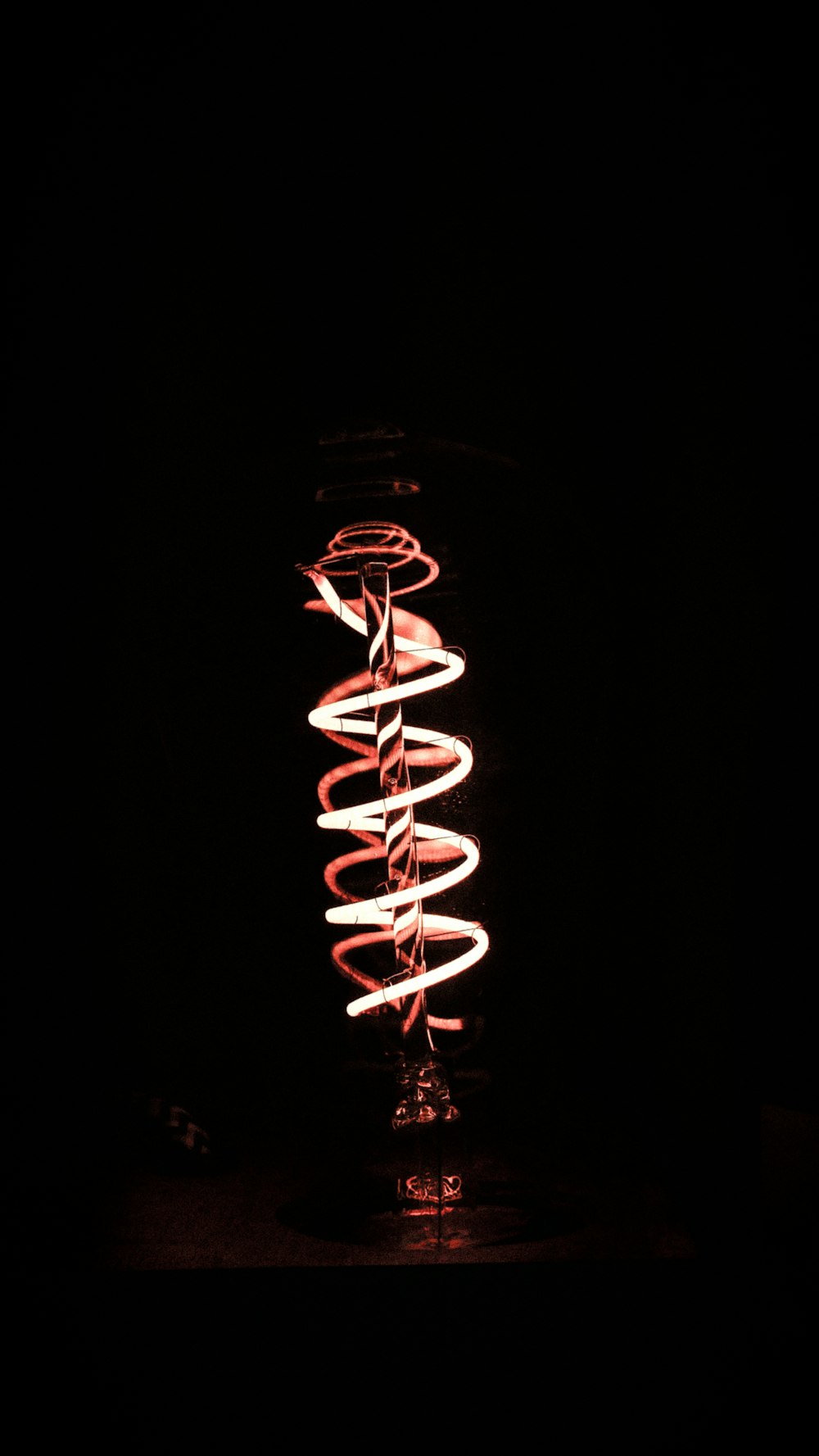 turned on spiral lamp inside dark room
