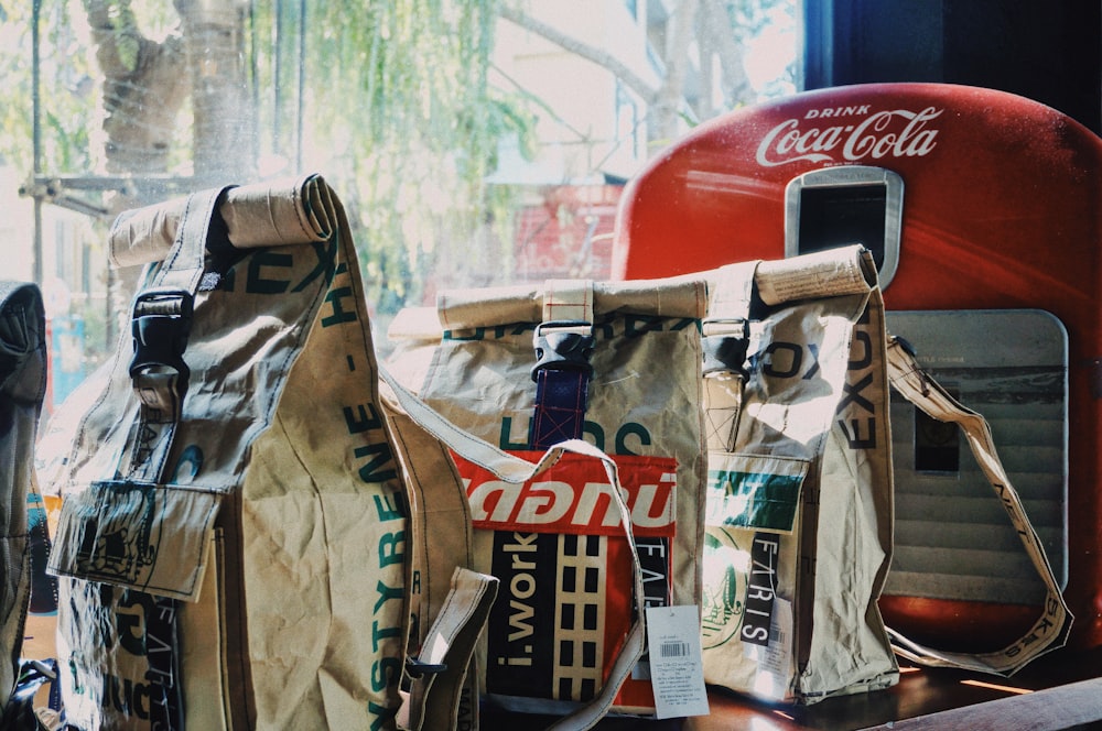 red and gray Coca-Cola device