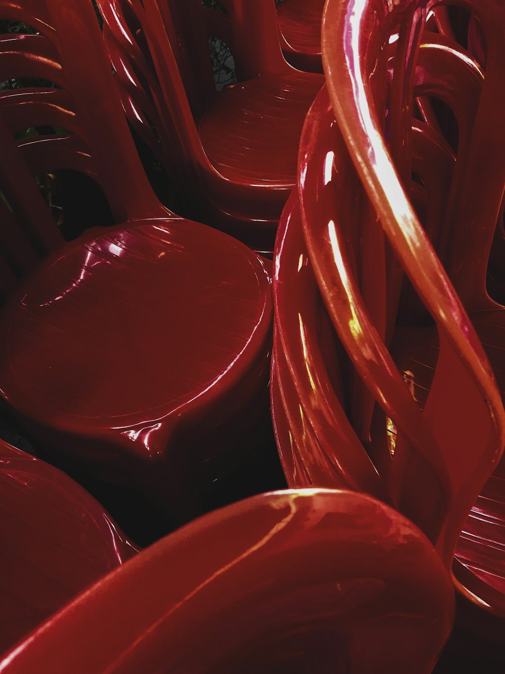 photo of stacks of red chairs