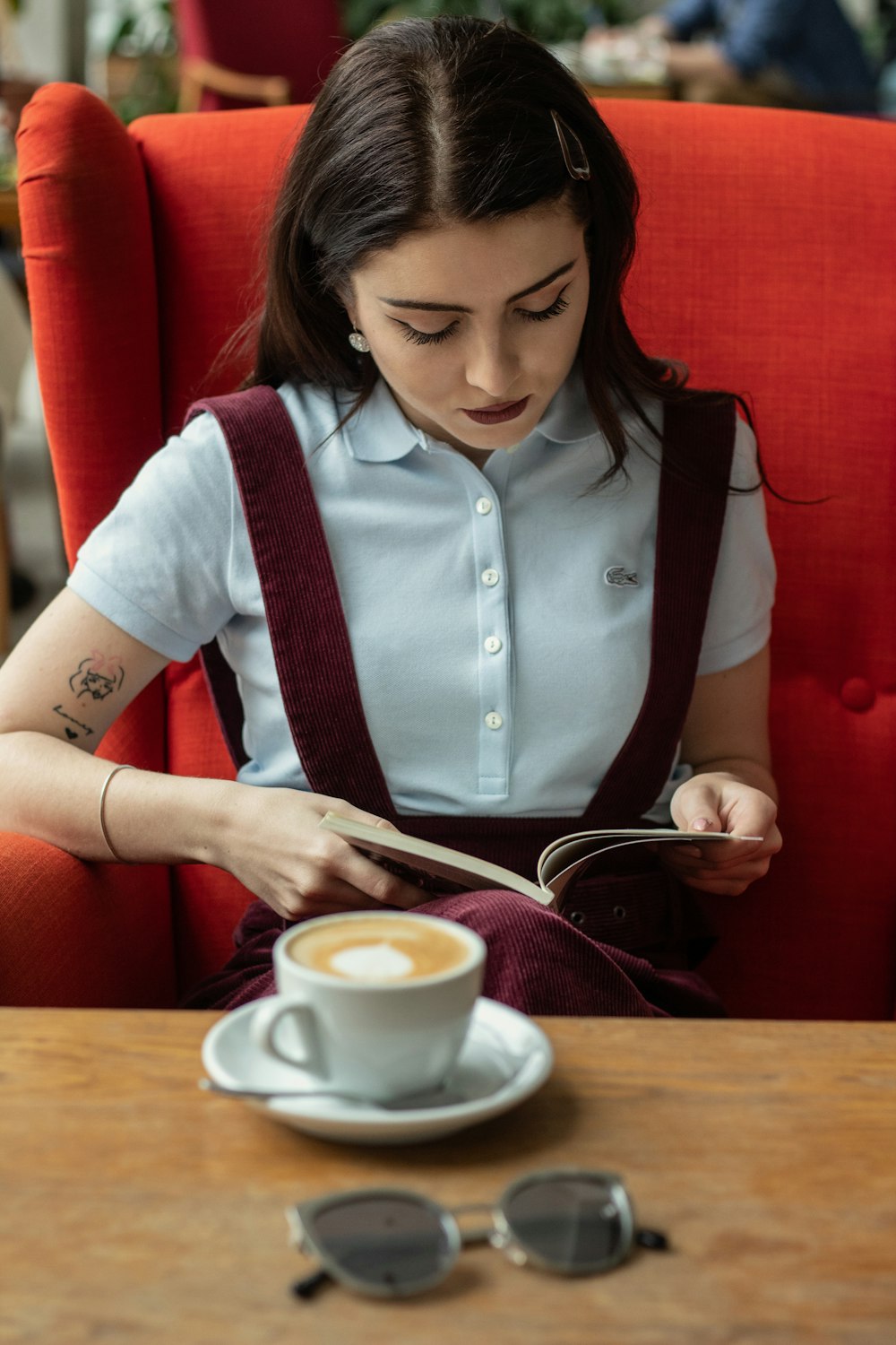 woman reading brown book