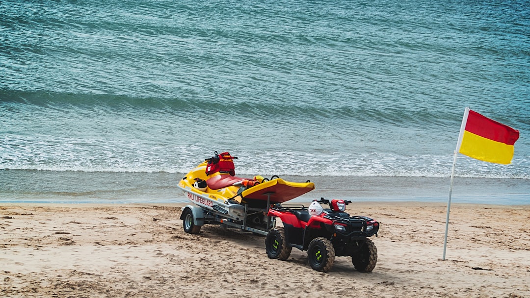 ATV with trailer on shore during daytime