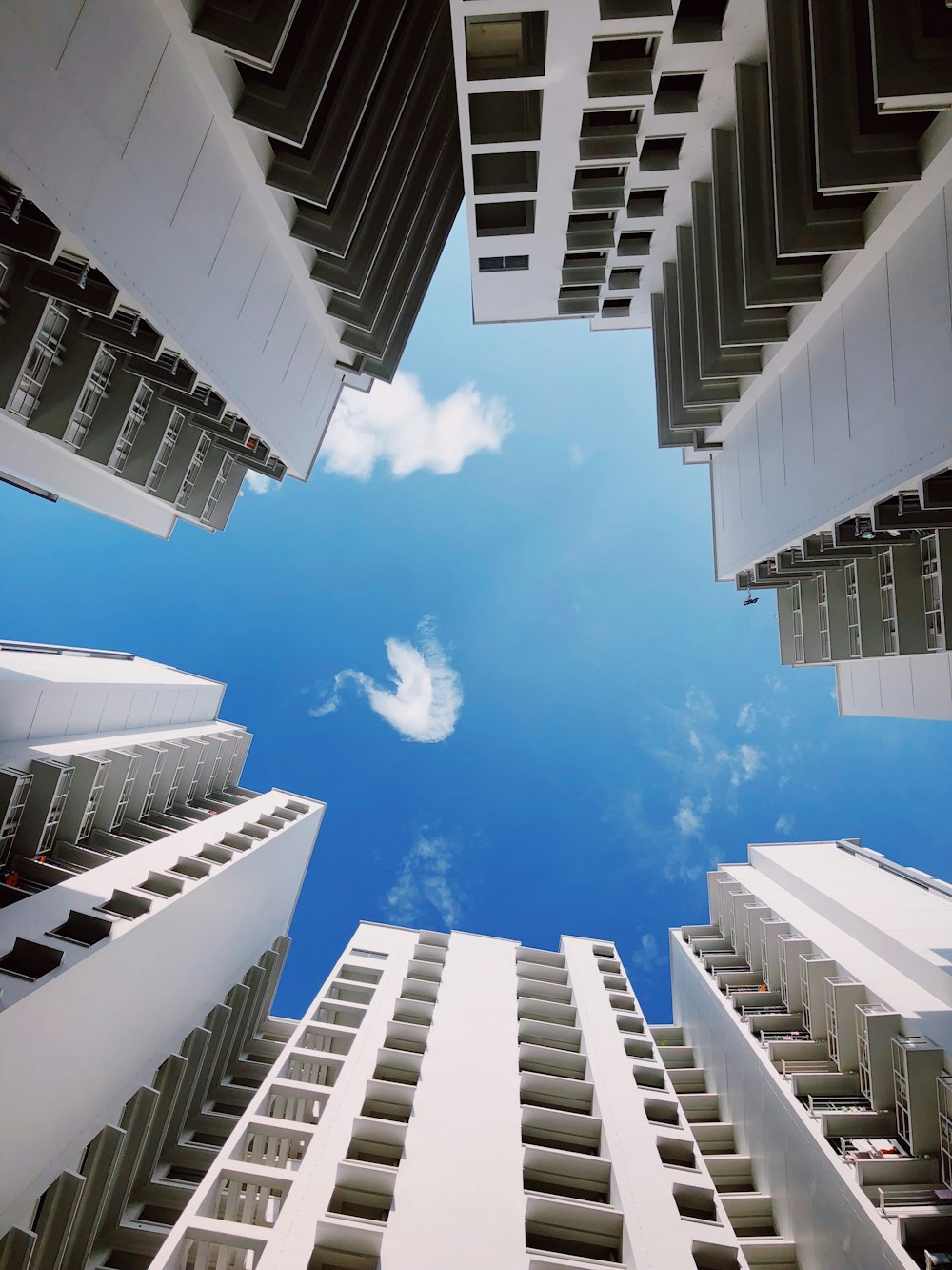 low-angle photography of high-rise buildings