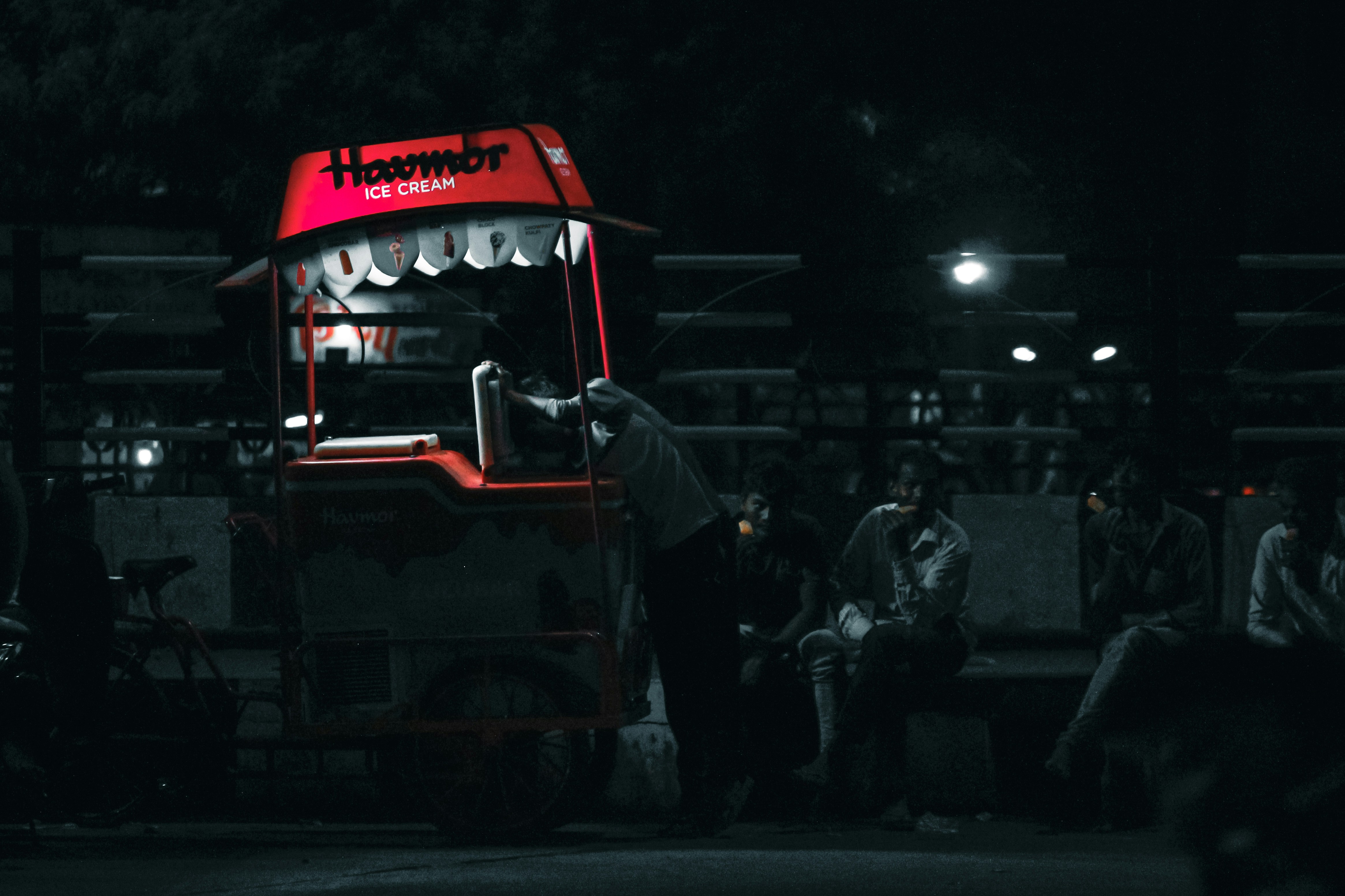 Ice Cream cart in sidewalk at night