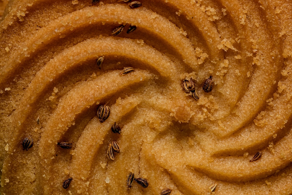 a close up of a cake with a bunch of bees on it