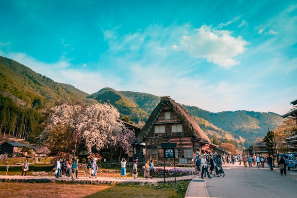 A group of happy tourists enjoying a traditional rural village tour.