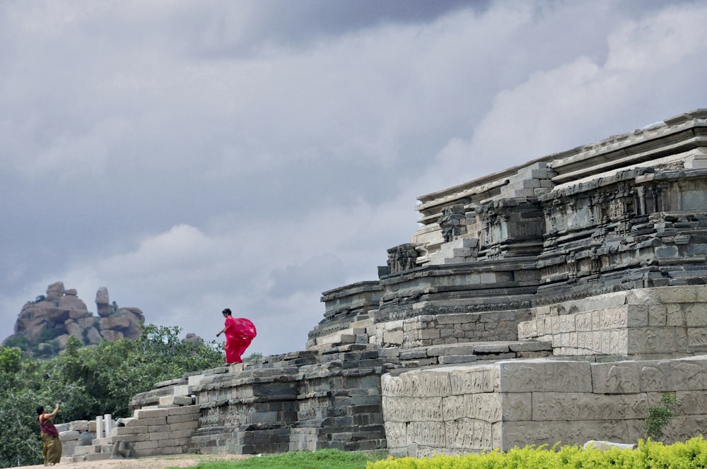 monk standing on grey concrete surface