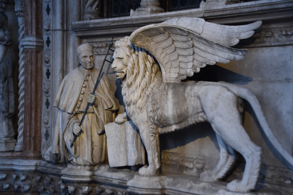 priest and lion statue