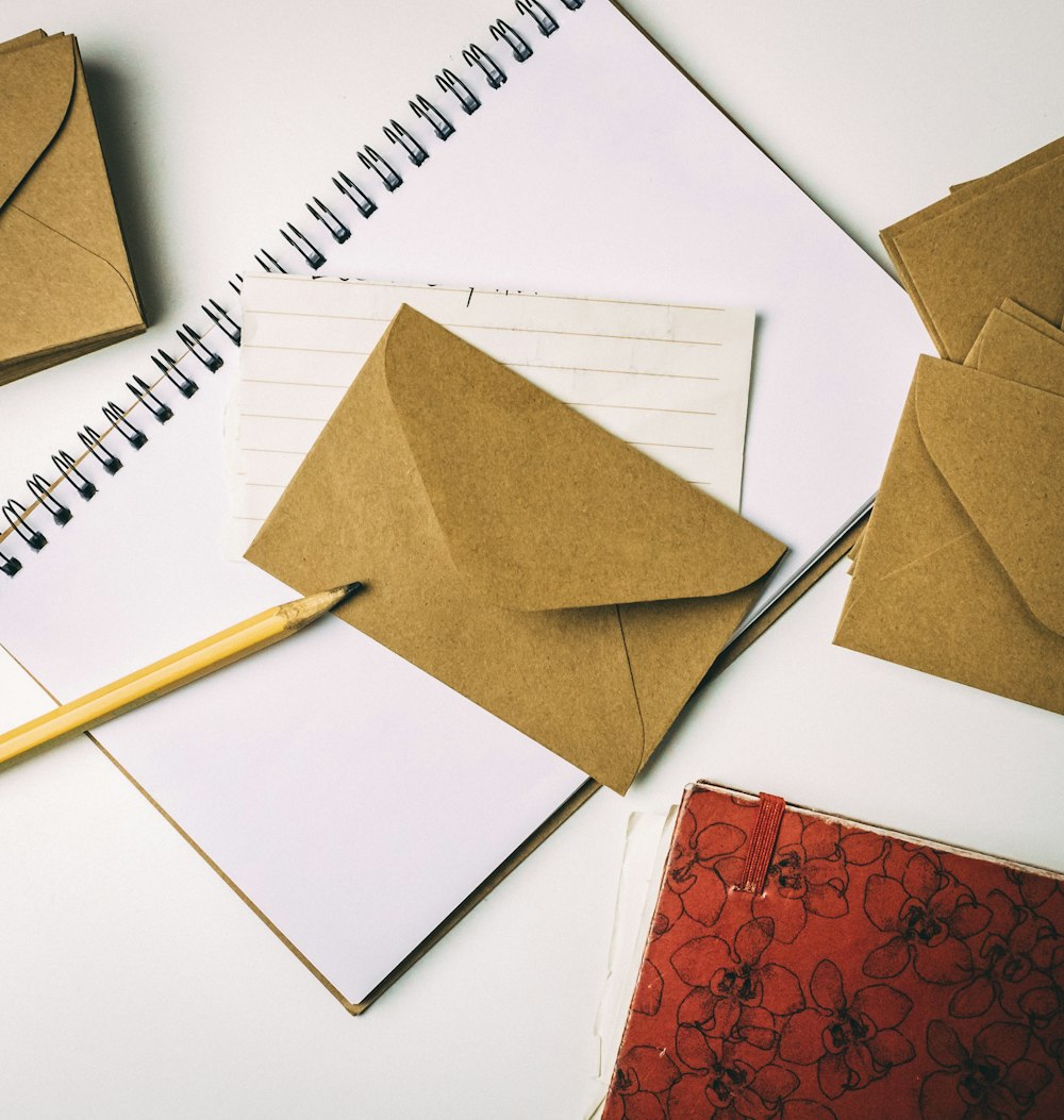 brown envelope on notebook