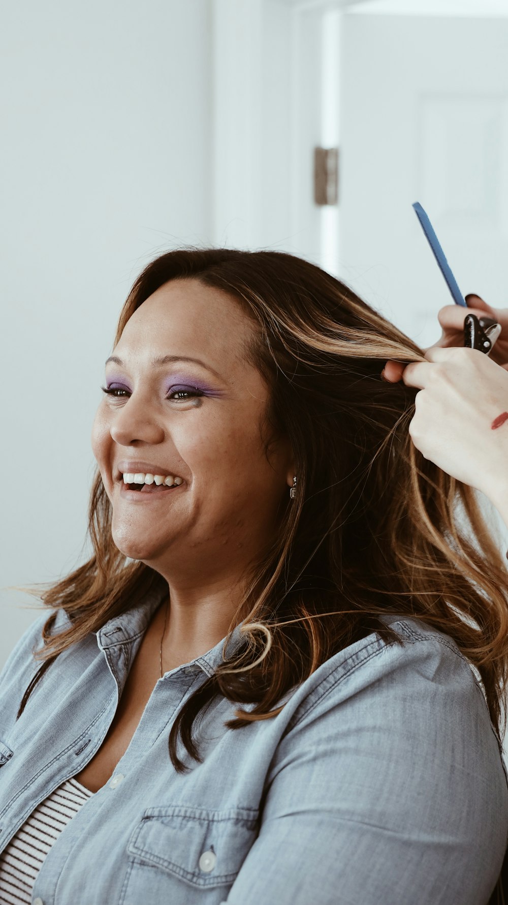 smiling woman wearing denim jacket