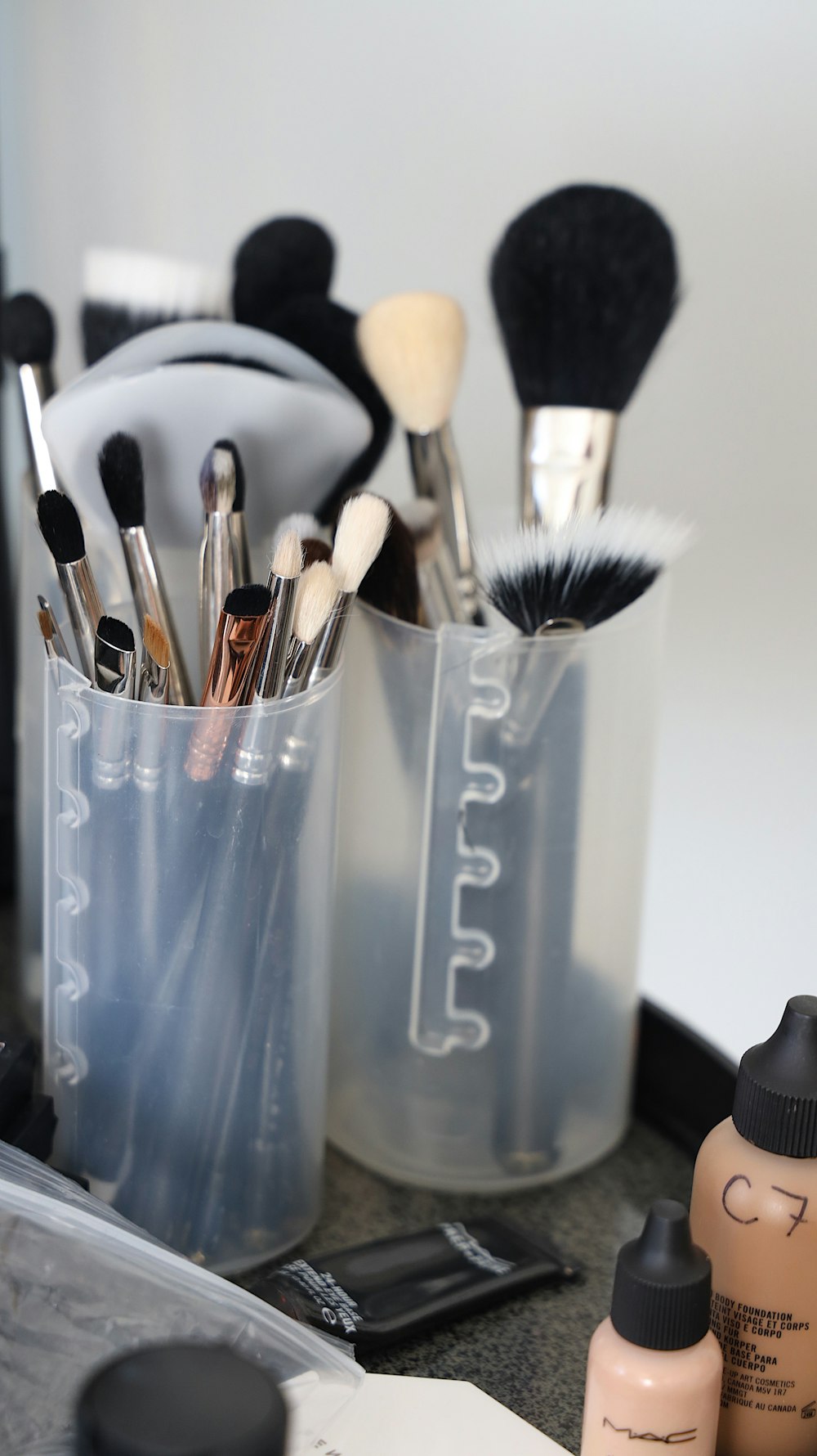 make-up brushes on white plastic organizers