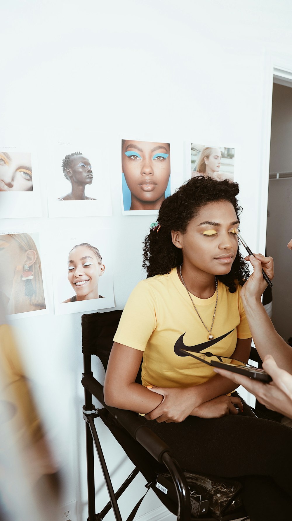 woman wearing yellow Nike t-shirt