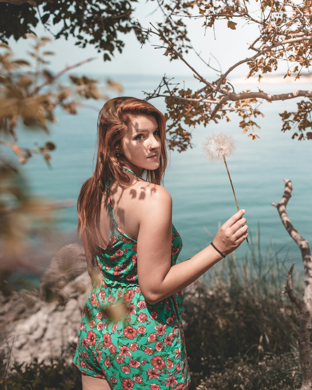 woman wearing blue and pink floral dress