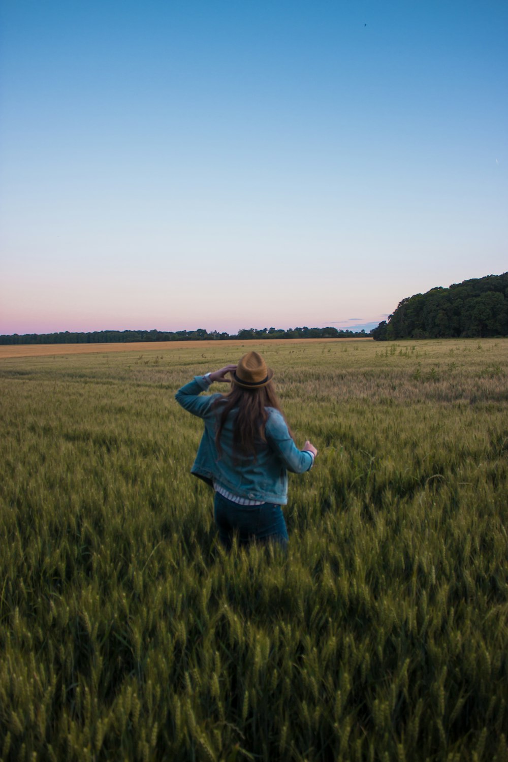 woman standing on green field