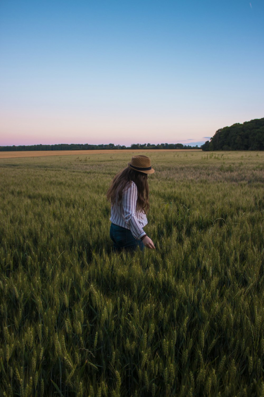 woman walking in wheat field