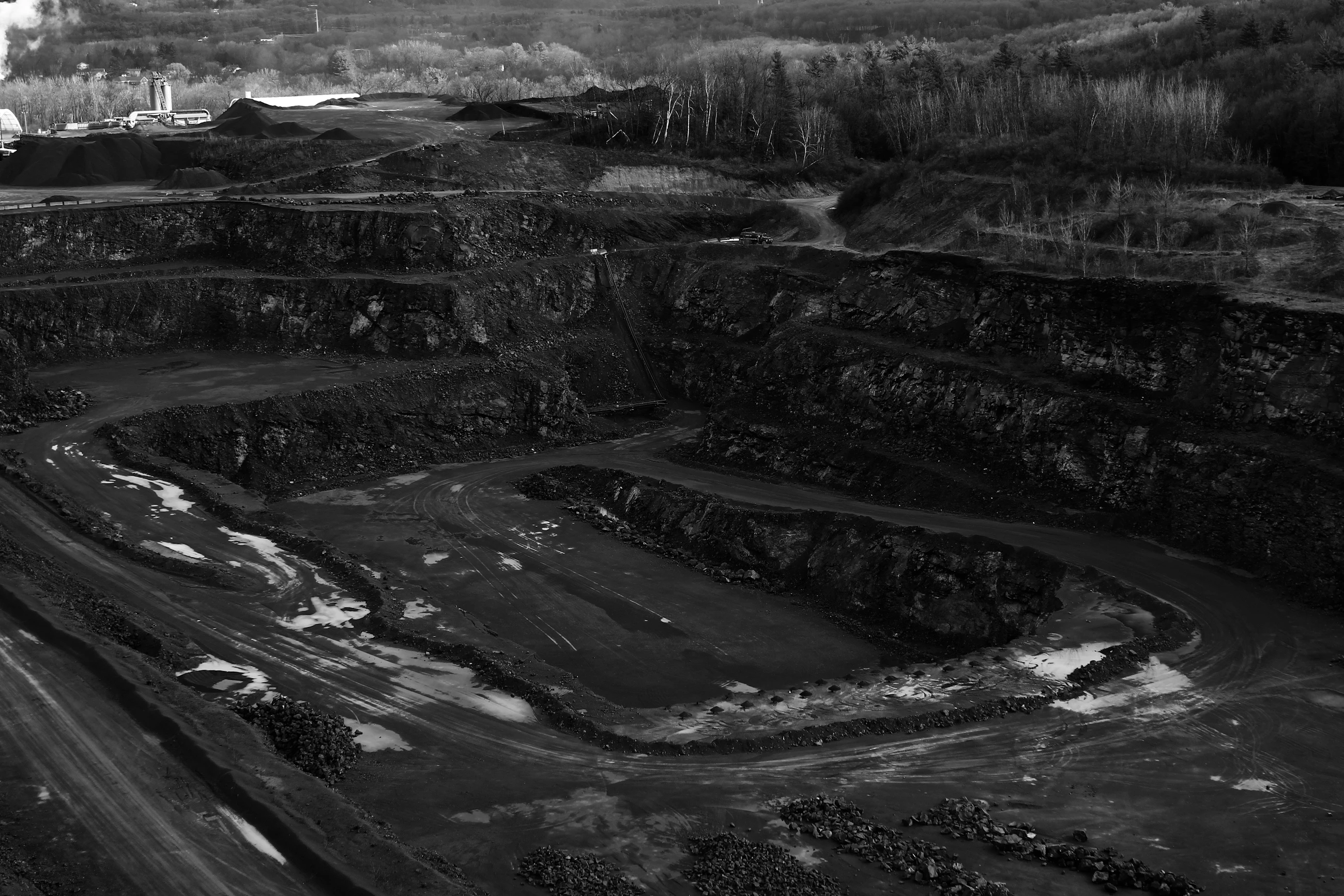 Benched walls of an open cut mine