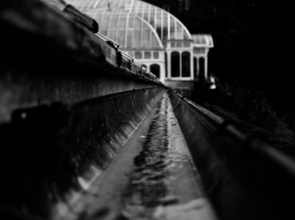 grayscale and close-up photography of train rail