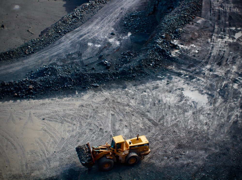 high angle photography of yellow excavator